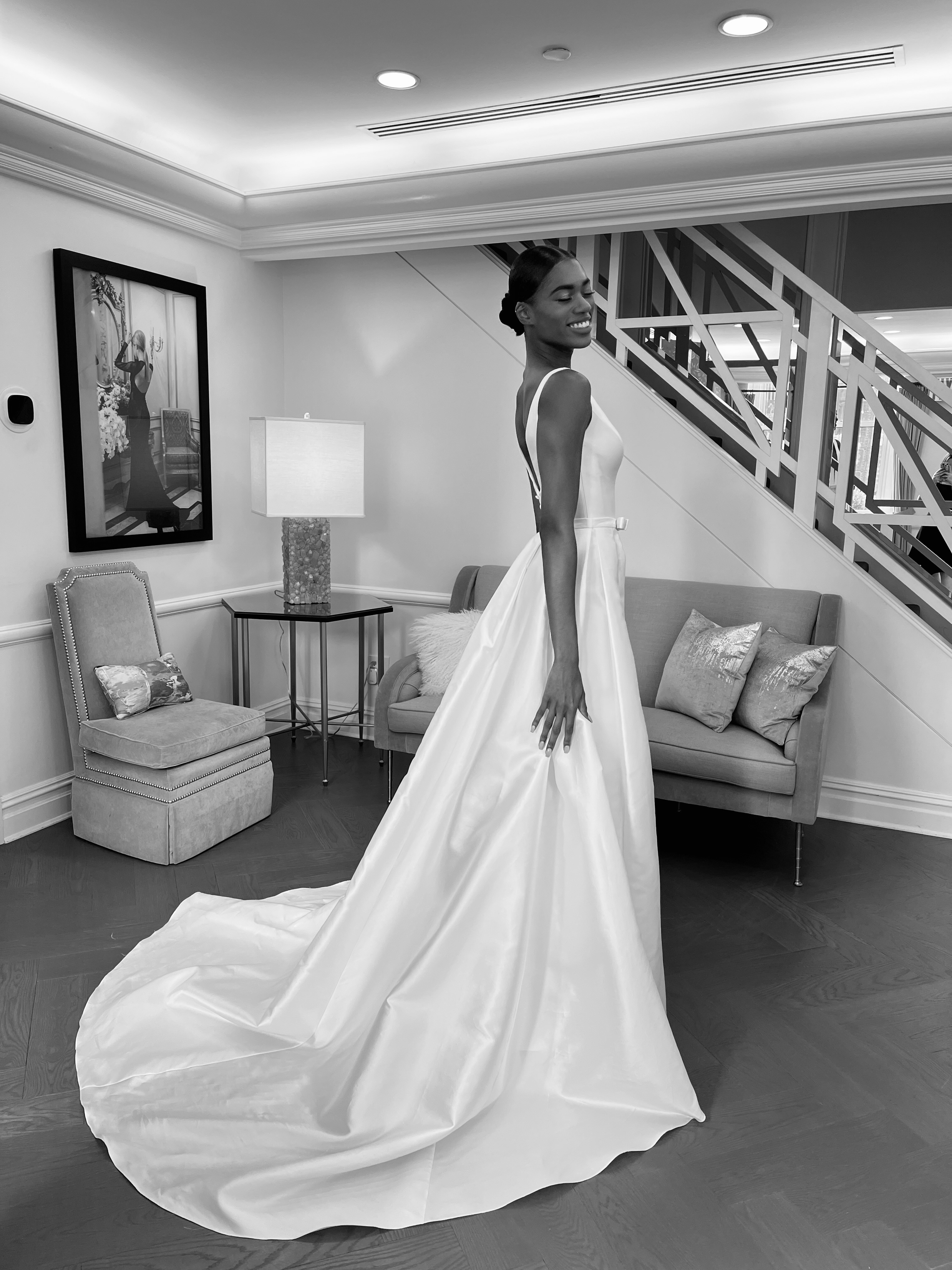 Bride in a satin ball gown with a long train, full-length reveal