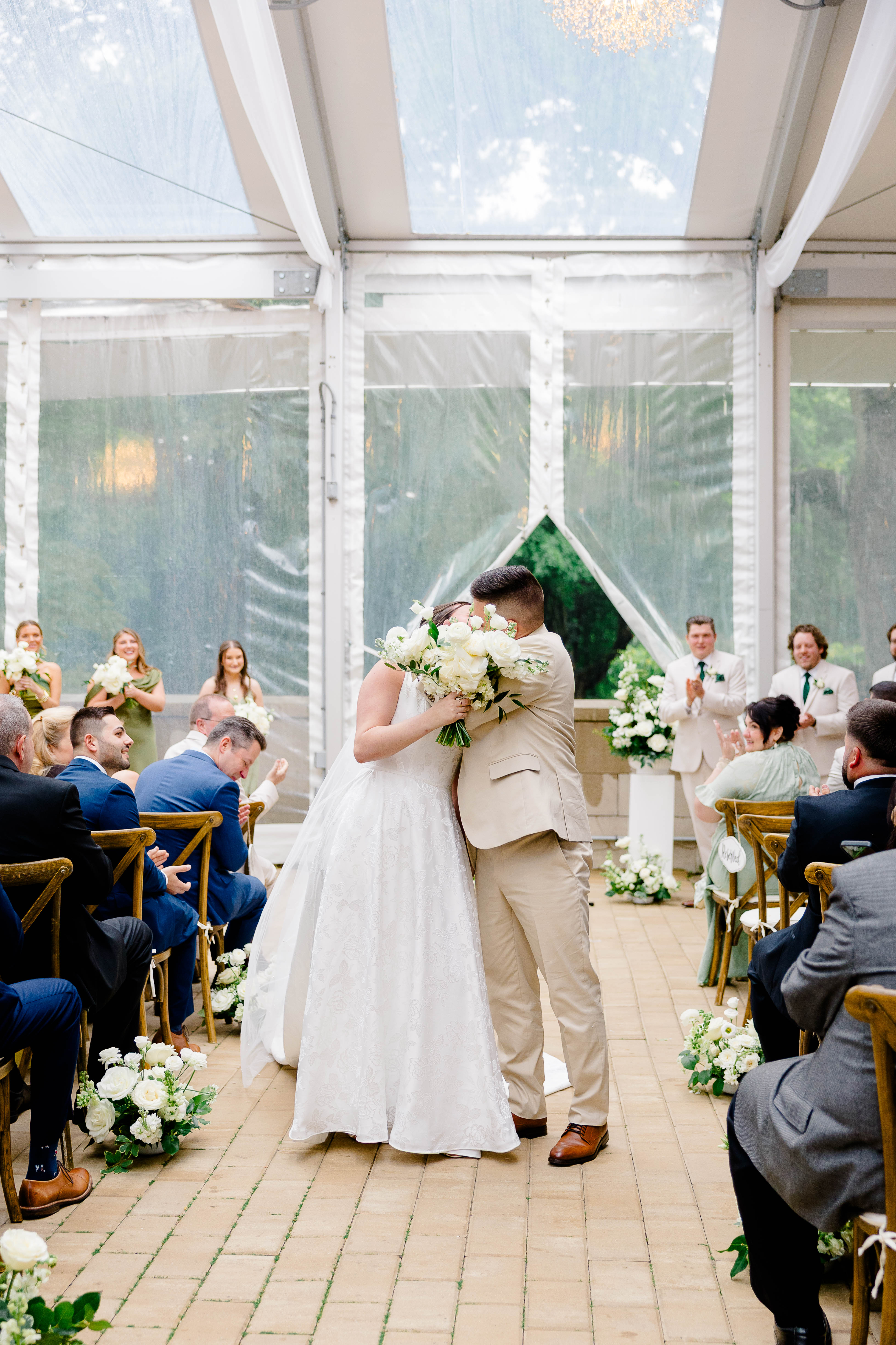 Shira and Mike sharing their first kiss as married couple at the ceremony